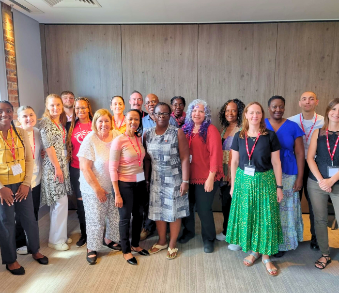 Alzheimer University 2023 participants and ADI team standing in a large group